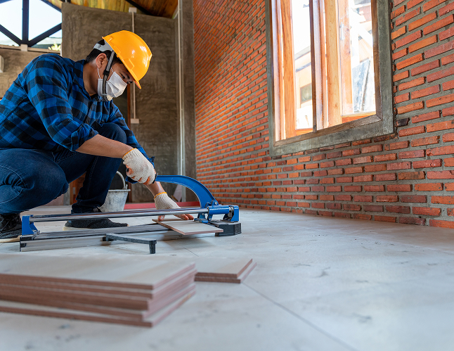 asian-artisan-tiler-construction-site-worker-cuts-large-slab-tile-construction-house-floor-tile-cutting-equipment